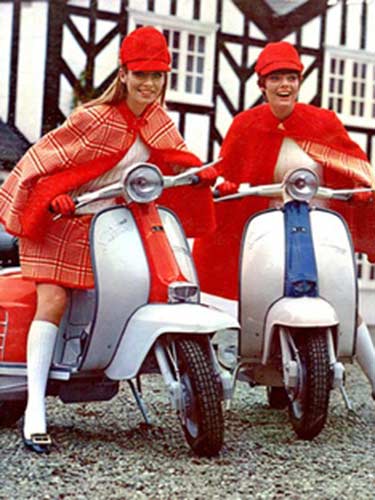 photograph of women on scooters